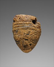 Pendant: Female Head; Italy; 500 - 480 B.C; Amber; 30 × 26 × 4 mm, 1 3,16 × 1 × 3,16 in
