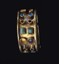 Bracelet; Roman Empire; 250 - 400; Gold, glass, and emeralds; 3.2 × 6.4 cm, 1 1,4 × 2 1,2 in