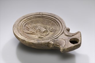 Lamp, North Africa, Tunisia; 3rd - 2nd century B.C; Terracotta; 2.6 x 8.2 x 11.4 cm, 1 x 3 1,4 x 4 1,2 in