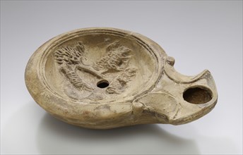 Lamp, North Africa; 1st - 4th century; Terracotta; 3.2 x 9.3 x 12.3 cm, 1 1,4 x 3 11,16 x 4 13,16 in