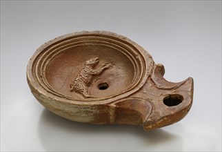 Lamp, North Africa; 1st - 4th century; Terracotta; 2.3 x 7.3 x 10.2 cm, 7,8 x 2 7,8 x 4 in