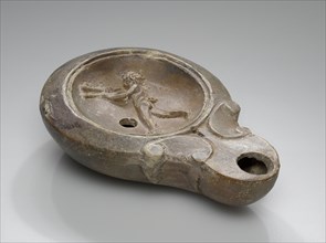 Lamp, North Africa; 1st - 4th century; Terracotta; 2.9 x 7.5 x 10.9 cm, 1 1,8 x 2 15,16 x 4 5,16 in