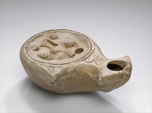 Lamp, Sainte Monique, North Africa; 1st - 4th century; Terracotta; 3 x 7 x 9.5 cm, 1 3,16 x 2 3,4 x 3 3,4 in