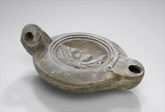 Lamp, North Africa; 1st - 4th century; Terracotta; 2.1 x 7 x 10.2 cm, 13,16 x 2 3,4 x 4 in