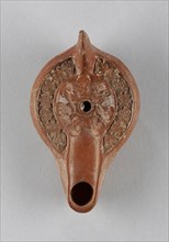 Lamp, North Africa; 1st - 4th century; Terracotta; 3.4 x 8.7 x 14.5 cm, 1 5,16 x 3 7,16 x 5 11,16 in