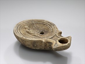 Lamp, Roman Empire; 1st century B.C. - 4th century A.D; Terracotta; 2.4 x 6.5 x 9.4 cm, 15,16 x 2 9,16 x 3 11,16 in