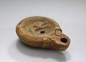 Lamp, Roman Empire; 1st century B.C. - 4th century A.D; Terracotta; 9.2 x 2.6 x 6.7 cm, 3 5,8 x 1 x 2 5,8 in