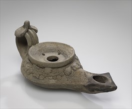 Lamp, South Anatolia, Anatolia; 1st century B.C. - 4th century A.D; Terracotta; 4.5 x 7.8 x 16.5 cm, 1 3,4 x 3 1,16 x 6 1,2 in