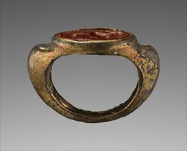 Engraved Gem with a Portrait of a Woman set into a Ring; about 200; Gem: red jasper; ring: gilded silver; 1.5 × 1.1 cm