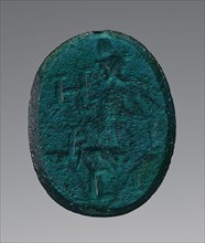 Engraved Gem, Roman Empire; 2nd - 4th century; Greenish-blue glass; 2 × 1.6 cm, 13,16 × 5,8 in