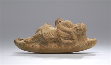 Lamp with a Reclining Comic Actor; Roman Empire; 2nd century; Terracotta and pigment; 7 × 16.3 cm, 2 3,4 × 6 7,16 in