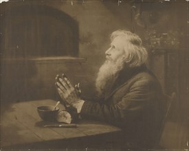 Man praying over meal; Rudolf Eickemeyer, Jr., American, 1862 - 1932, New York, United States; about 1900 - 1915; Gelatin