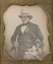Portrait of a Seated Man in Hat with Walking and Dog; American; about 1845; Daguerreotype, hand-colored; 7 x 5.7 cm