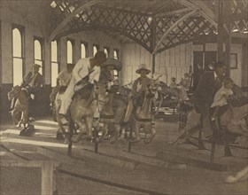 People Riding on a Carousel; Louis Fleckenstein, American, 1866 - 1943, about 1910; Sepia toned gum bichromate print