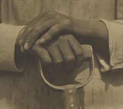 Hands Resting on Tool; Tina Modotti, American, born Italy, 1896 - 1942, Mexico; 1927; Palladium print; 19.7 x 21.6 cm