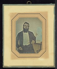 Portrait of a Bearded Man Wearing Wire-Rimmed Glasses seated next to a Bust of Voltaire by Houdon; French; July 28, 1843