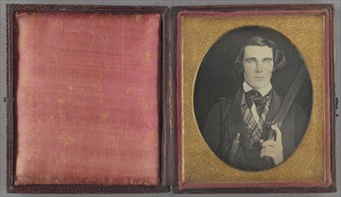 Portrait of a Man with Rifle and Powder Horn; American; 1842 - 1845; Daguerreotype, hand-colored