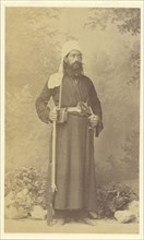 Moine grec. Monk armed with pistol and rifle; William J. Stillman, American, 1828 - 1901, 1860s; Albumen silver print