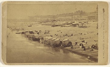 Beach scene showing bathing cabinets at shoreline, Brighton, England; W. Hall, British, active 1865 - 1890, about 1870; Albumen