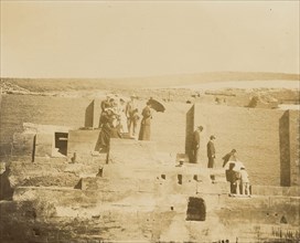 Men and women standing on steps of ruin; about 1860 - 1880; Tinted Albumen silver print