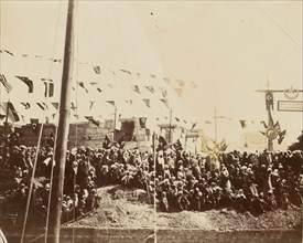 Crowd under multi-national flags; Egypt; about 1860 - 1880; Tinted Albumen silver print