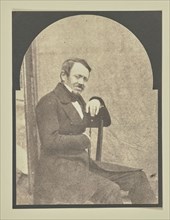 man seated before a portable backdrop; Hippolyte Bayard, French, 1801 - 1887, 1847; Salted paper print from a Calotype negative