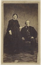couple: woman standing, man seated; 1865 - 1870; Albumen silver print