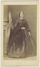 woman in long black dress, standing; F. Schwarzschild, British, active Calcutta, India 1860s, about 1865; Albumen silver print
