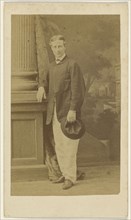 young man standing with cigar in one hand, his hat in the other; F. Schwarzschild, British, active Calcutta, India 1860s, 1860s