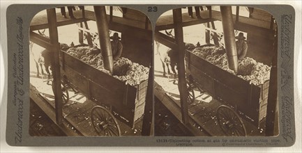 Unloading cotton at gin by pnematic suction pipe, Georgia; Underwood & Underwood, American, 1881 - 1940s, about 1900; Gelatin