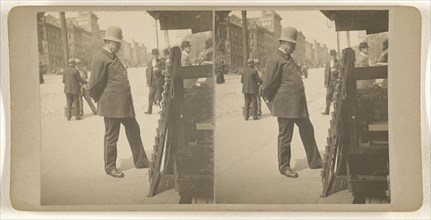 Policeman on Albany, N.Y. street reading newspapers on rack; Julius M. Wendt, American, active 1900s - 1910s, 1900s; Gelatin