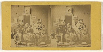 Family portrait, taken in living room, photographs and paintings on the wall behind; about 1865; Albumen silver print