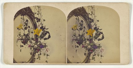 Hanging flower arrangment by a mirror; about 1865; Hand-colored Albumen silver print