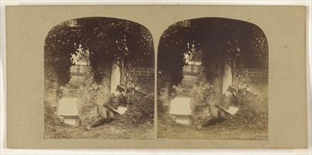 Boy on ground reading a letter or book; British; about 1860; Albumen silver print