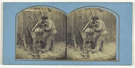 Man sharpening blade on foot-operated whetstone; French; about 1865; Albumen silver print