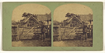 Man holding a pitchfork at gate of French farm; French; about 1865; Albumen silver print