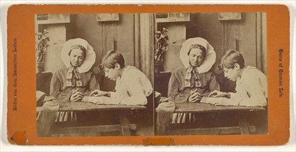 German woman and boy reading at table; German; about 1870; Albumen silver print