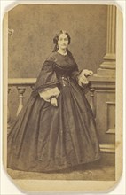 woman in long dress, standing; Edward S. Dunshee, American, active 1850s - 1890s, about 1870; Albumen silver print