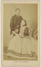 couple: man standing and woman seated; F. Deron, Belgian, 1819 - 1876, 1870s; Albumen silver print