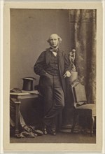man standing, top hat on table; Camille Silvy, French, 1834 - 1910, 1860s; Albumen silver print