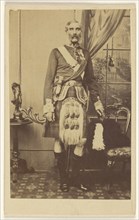 bearded man with metals on chest, wearing kilt, standing; F.W. Baker, British, active Calcutta, India 1860s, 1860s; Albumen