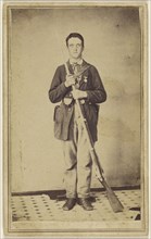man holding a musket with bayonet attached, standing; 1860s; Albumen silver print