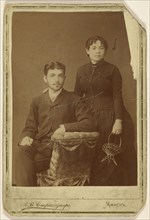 Portrait of a young couple: man seated and woman standing; M.W. Straschuner, Russian, active Moscow, Russia 1870s, about 1880