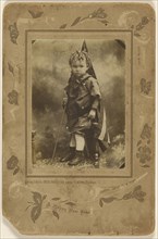 Little boy holding an American flag, standing on a chair; A. Rinin, American, active 1900s, about 1900; Gelatin silver print