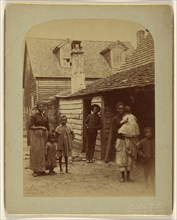 Portrait of a black family standing in front of a house; George Barker, American, 1844 - 1894, 1886; Albumen silver print