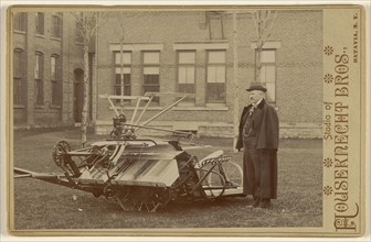 Man posing with a piece of farm machinery; Houseknecht & Brothers; about 1885; Gelatin silver print
