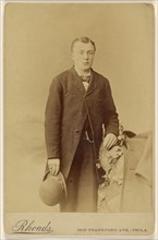 Man holding derby, standing; William H. Rhoades, American, active Philadelphia, Pennsylvania 1870s, 1880s; Albumen silver print