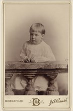 Portrait of a little girl posed on a stone railing; J.A. Brush, American, active 1880s - 1890s, about 1888; Gelatin silver