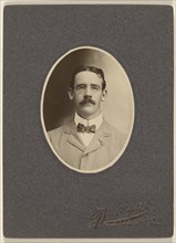 man with moustache wearing wire-rimmed glasses; Buckley & Company; about 1900; Platinum print