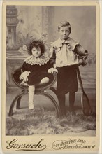 little girl seated, next to little boy with tennis racket standing; Gorsuch, American, active 1870s - 1890s, 1890s; Gelatin